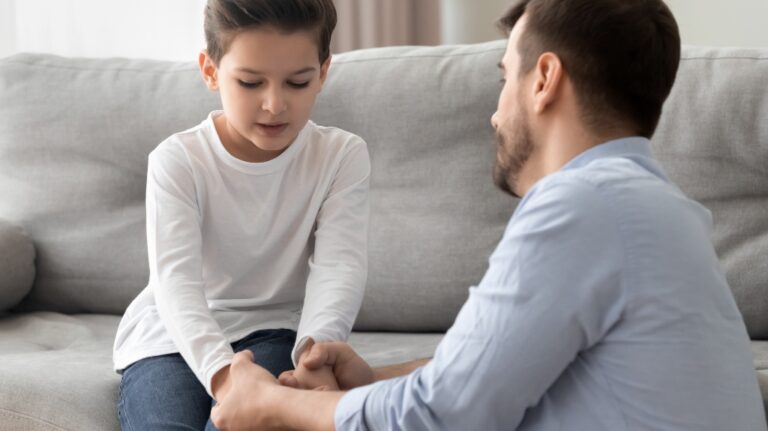 dad comforting son