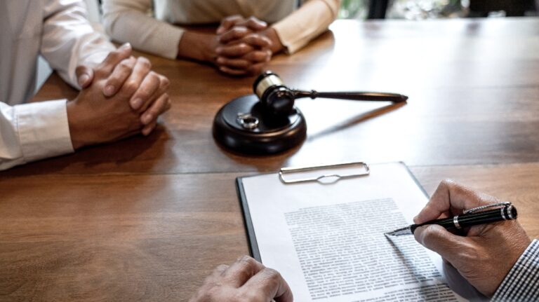 couple during divorce process with senior male lawyer