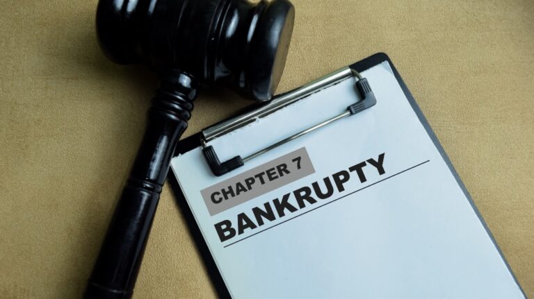 Concept of Chapter 7 Bankrupty write on paperwork isolated on wooden background